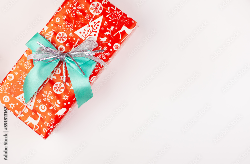 Beautifully pack New Year's gift isolated on white background. Holiday, New Year's mood. Close-up.