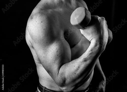 Obraz na płótnie Matured man with naked muscular torso making exercises