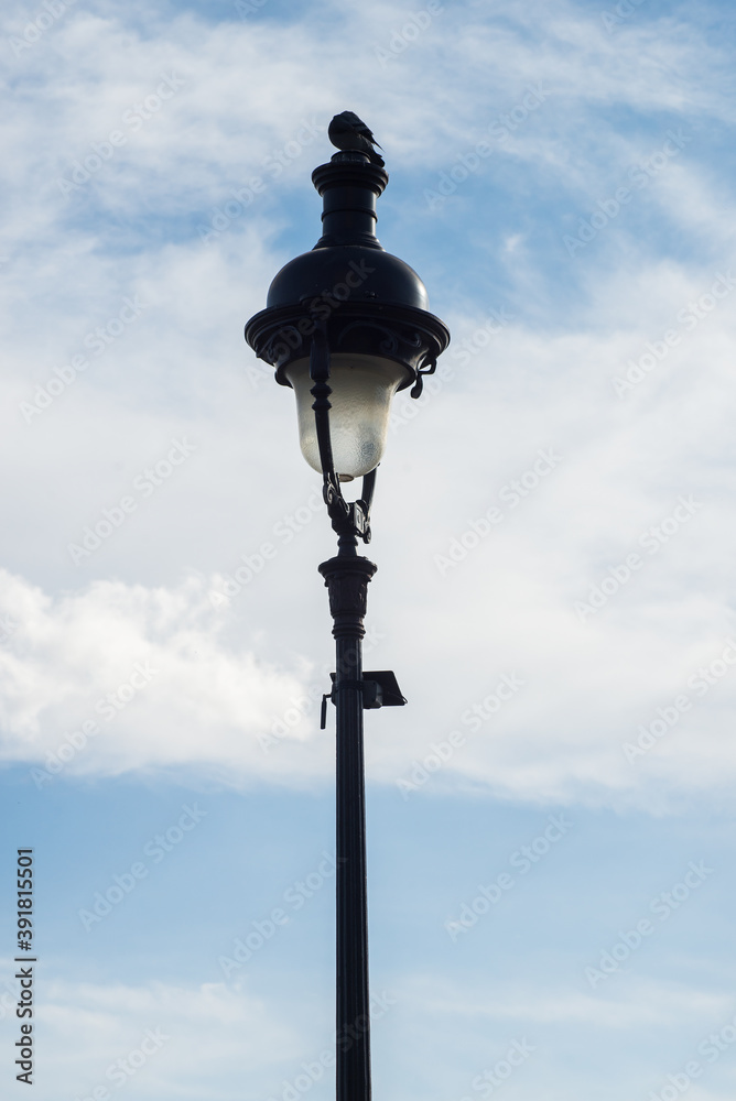 Closeup of street light  from Montmartre quarter in Paris on beautiful blue cloudy sky background