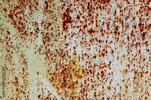 Background of metal sheet covered with white paint with numerous traces of corrosion