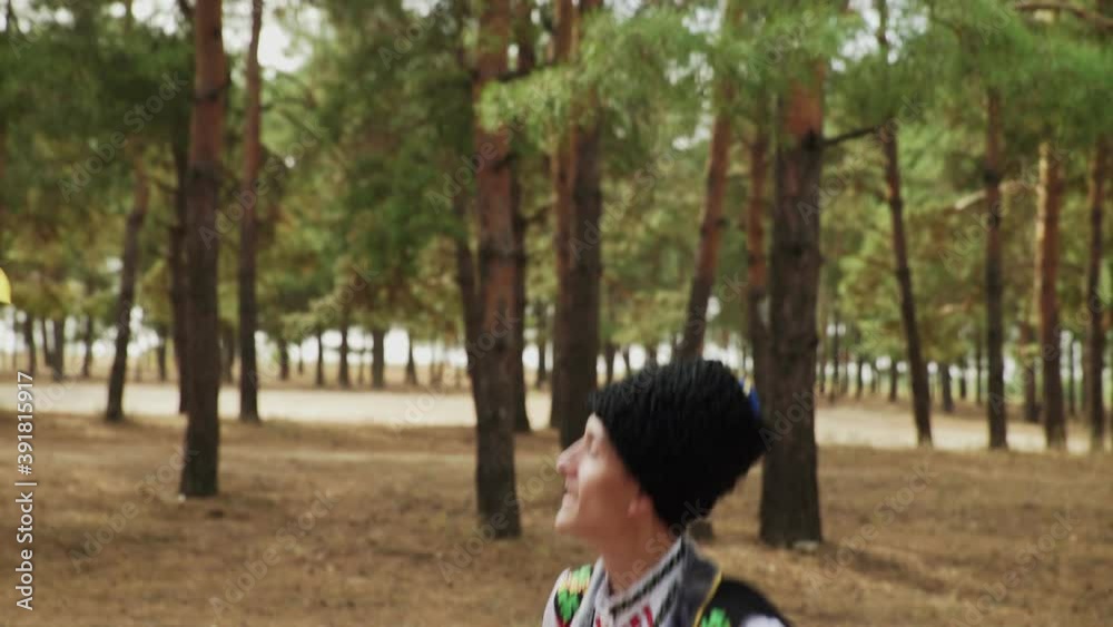Close up of couple in traditional costumes are dancing Ukrainian national dances Close up of couple in traditional costumes are dancing Ukrainian national dances
