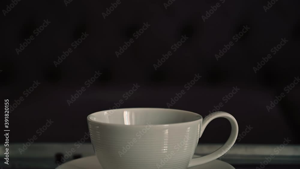 Coffee machine pouring coffee on a white cup Coffee machine pouring coffee on a white cup
