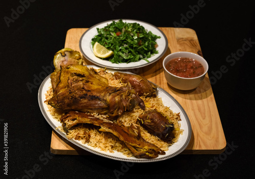 Rice biryani and lamb - a traditional Arab dish (mandi,  haneeth)