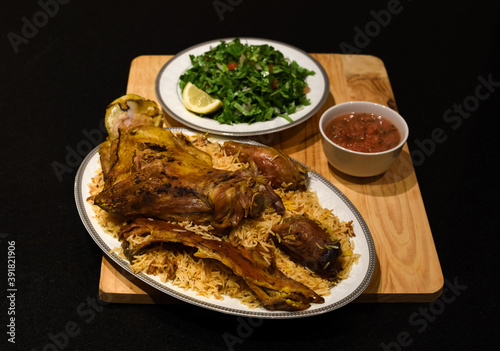 Rice biryani and lamb - a traditional Arab dish (mandi,  haneeth) photo