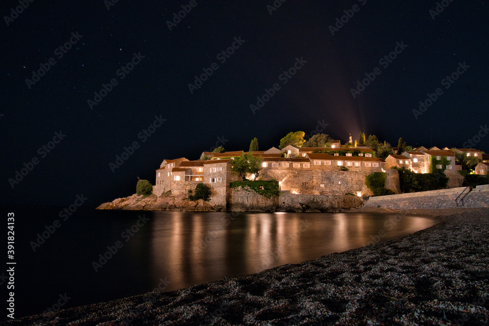 Sveti Stefan island town. view of the night city in Montenegro