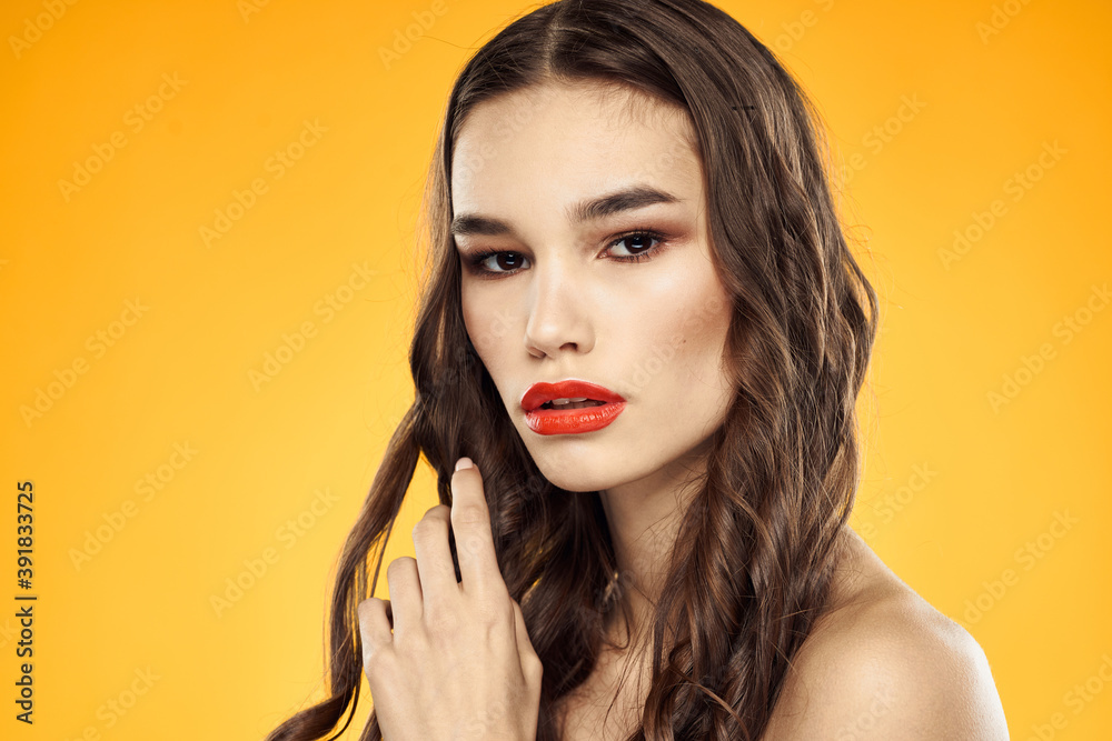 Woman with bare shoulders red cropped lips charm yellow background Woman with bare shoulders red cropped lips charm yellow background