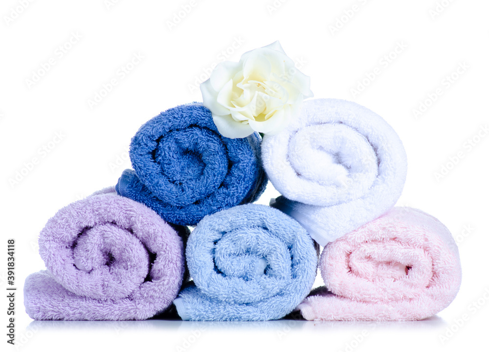 Rolled towels with flower on white background isolation Rolled towels with flower on white background isolation