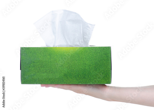 Box with napkins wipes in hand on white background isolation