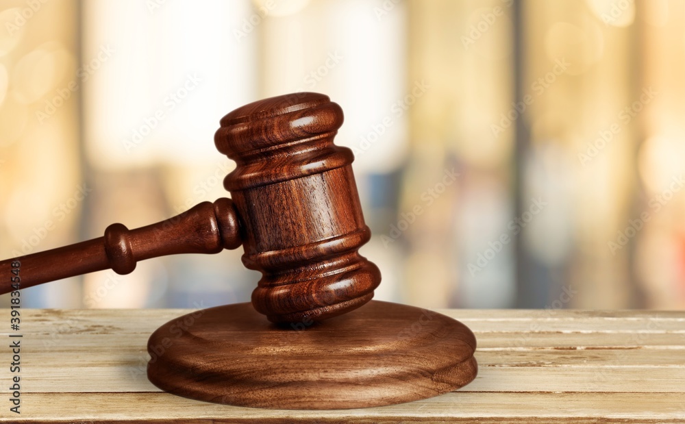 Wooden judge gavel on wood desk Wooden judge gavel on wood desk