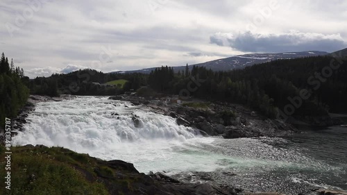 Laksefossen - Salmon river mighty and beautiful. Vefsna is the largest watercourse in Nordland and drains southern parts of the county from Børgefjell in the south to Mosjøen in the north.  photo