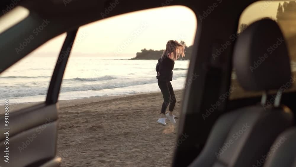 Woman in slow motion running from car through the sea beach, feel exciting on sea beach Woman in slow motion running from car through the sea beach, feel exciting on sea beach