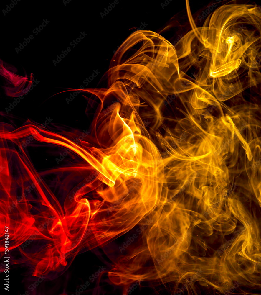 Fototapeta premium Colored smoke on black background