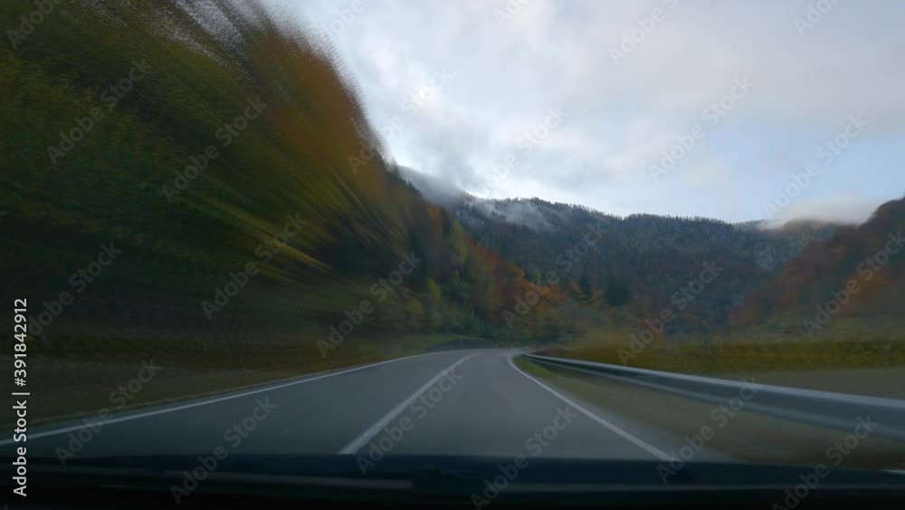 POV point of view sped up dashcam dash camera driving on paved countryside road, Slovenia, towards Bohinj lake. Alpine colorful autumn valley. Wide angle, forward dolly moving POV point of view sped up dashcam dash camera driving on paved countryside road, Slovenia, towards Bohinj lake. Alpine colorful autumn valley. Wide angle, forward dolly moving