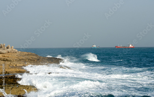 Stormy autumn day in Marsaskala, Malta. Big waves, sunny day, dangerous sea. Winter in Malta