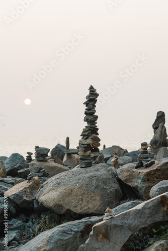 Stone pyramids on the beach at sunset. Balance, tranquility, harmony concept © Hanna Tor
