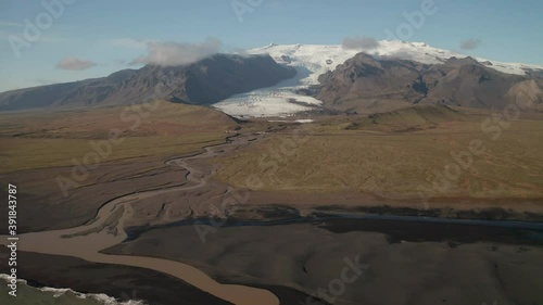 Glacial River From Kviarjokull Glacier Outlet In From South Site Of Oraefajokull Glacier In South Iceland - pullback drone photo