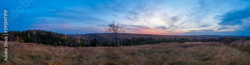Panorama of autumn Stone Hill park in sunset light. © Evgesha