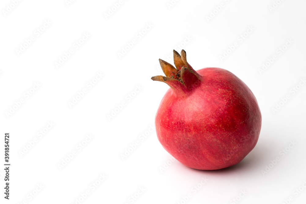Whole pomegranate in studio on white background Whole pomegranate in studio on white background