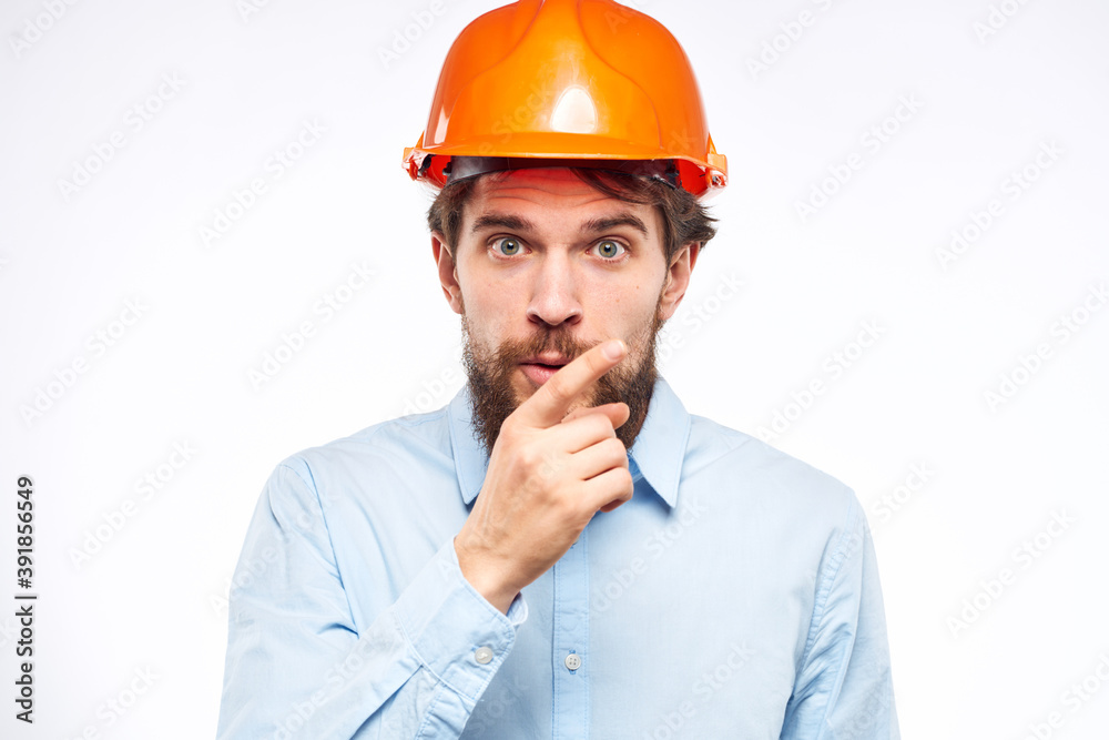Man in orange helmet shirt construction engineer industry work Man in orange helmet shirt construction engineer industry work
