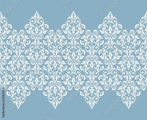 Wallpaper in the style of Baroque. Seamless vector background. White and blue floral ornament. Graphic pattern for fabric, wallpaper, packaging. Ornate Damask flower ornament
