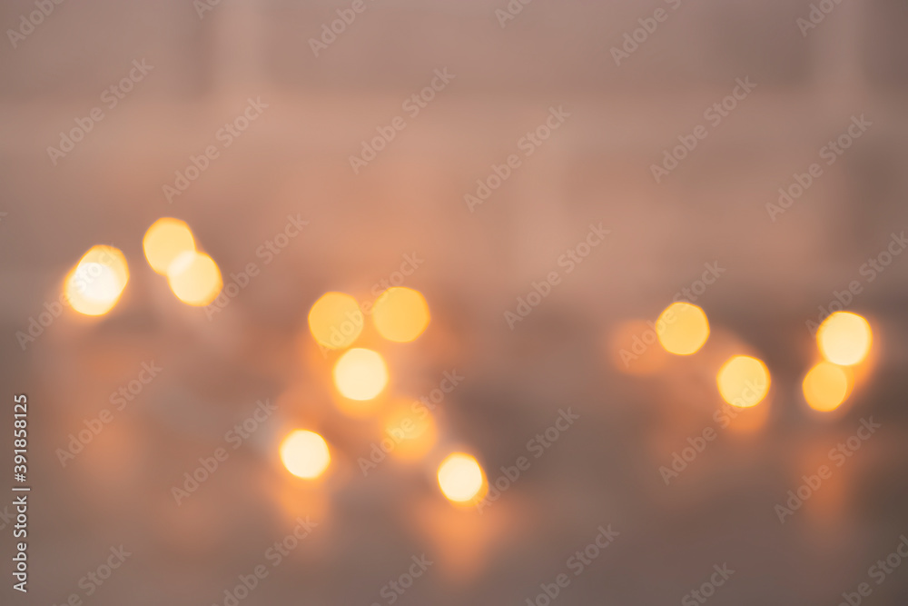 Christmas and New Year concept. Glowing garland out of focus on gray background. Christmas and New Year concept. Glowing garland out of focus on gray background.