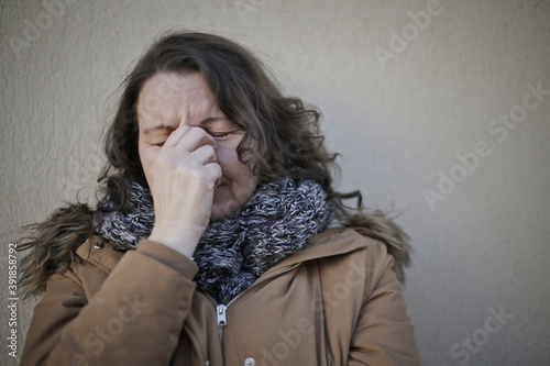 
portrait of donan ceh crying leaning against a wall photo