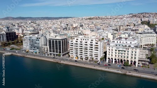 Aerial shot of Aristotelous square in the center of Thessaloniki, Greece, street with cars, side movement by drone photo