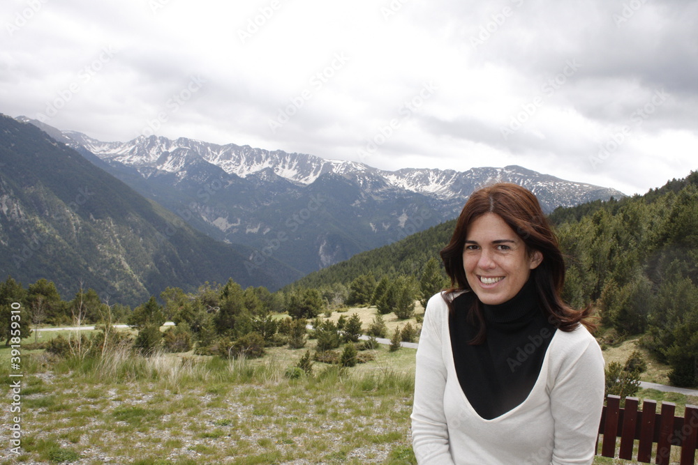 young girl sitting with mountains in andorra
