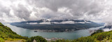 Panoramic view of Gastineau Channel, port of Juneau and mountains covered with clouds from the top of mountain Roberts in Alaska