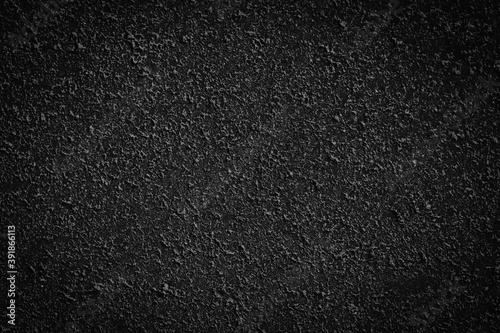 Abstract black background with concrete wall texture. Dark mysterious stone wallpaper for elegant style decor, banner backdrop
