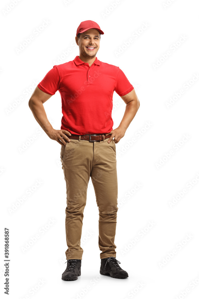 Full length portrait of a cheerul young male worker in a uniform posing Full length portrait of a cheerul young male worker in a uniform posing