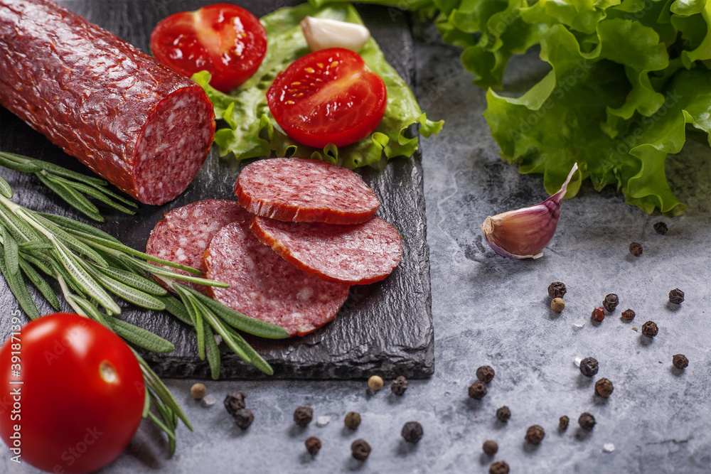 Dry-cured sausage with spices, garlic and herbs . Dry-cured sausage with spices, garlic and herbs .