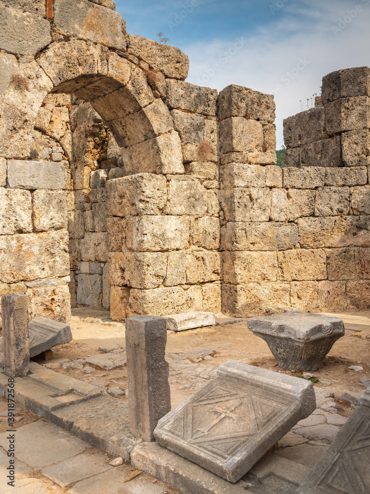 view to old ruins of antique church and christian cross on stone plate view to old ruins of antique church and christian cross on stone plate