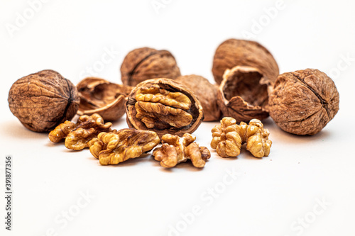 some walnuts against white background