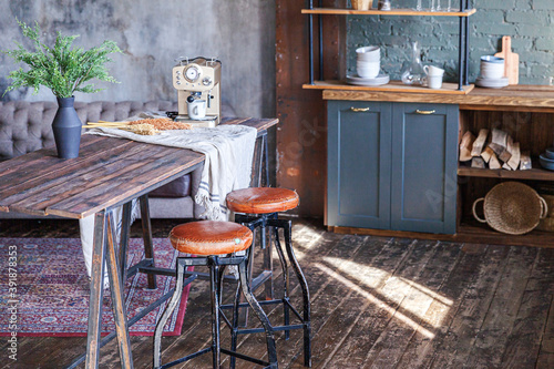 Scandinavian classic minimalistic dark gray kitchen with wooden details. Stylish loft modern gray kitchen decoration with clean contemporary style interior design.