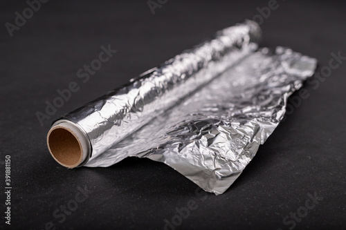 Aluminum foil wound on a cardboard roller. Material used to store food.