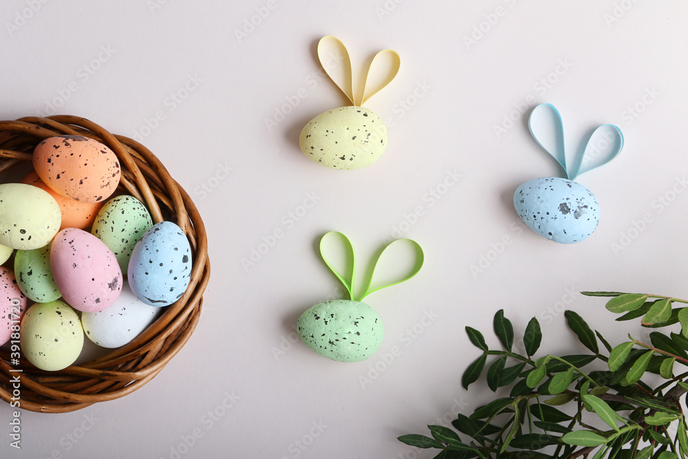 Colorful easter eggs in the rattan nest and flying creative bees.