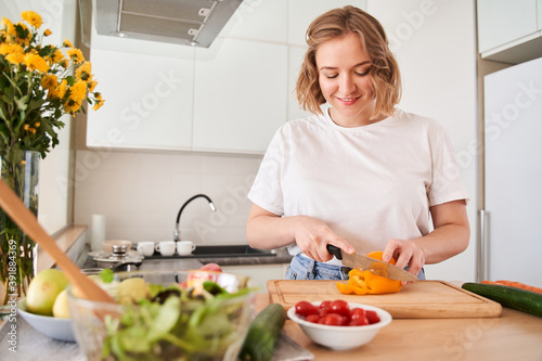 Woman preparing vegetables for the future salad