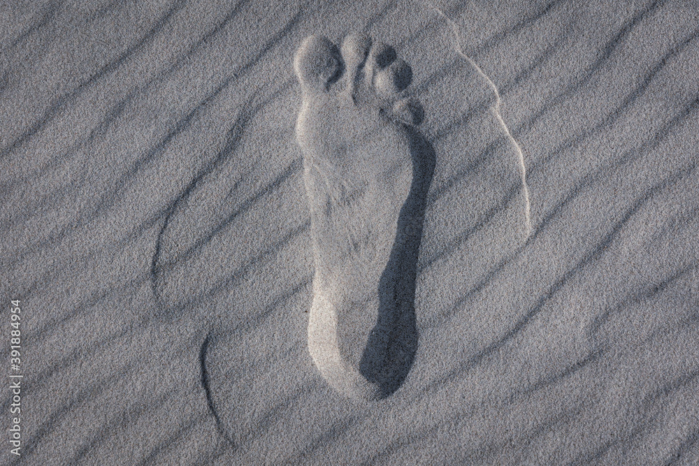 Fototapeta Male foot mark on a beach in Debki resort village on the Baltic Sea coast in Pomerania region of Poland
