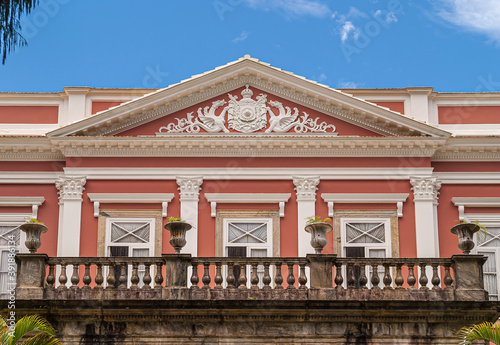 Bild auf Leinwand Petropolis, Brazil - December 23, 2008: Imperial emblem in white fresco on pink facade with white frames of windows on Imperial Museu, former palace