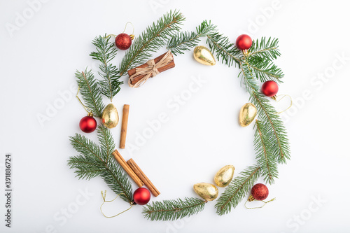 Christmas or New Year wreath composition. Decorations  balls  fir and spruce branches  on white background. Top view  copy space.