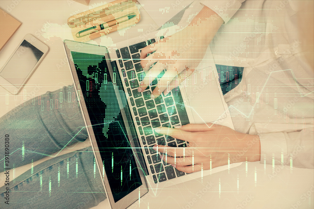 Double exposure of woman hands working on computer and forex graph hologram drawing. Top View. Financial analysis concept. Double exposure of woman hands working on computer and forex graph hologram drawing. Top View. Financial analysis concept.