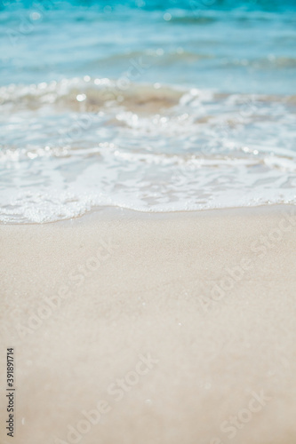 Fototapeta Naklejka Na Ścianę i Meble -  Soft blue ocean wave on sandy beach. Background.