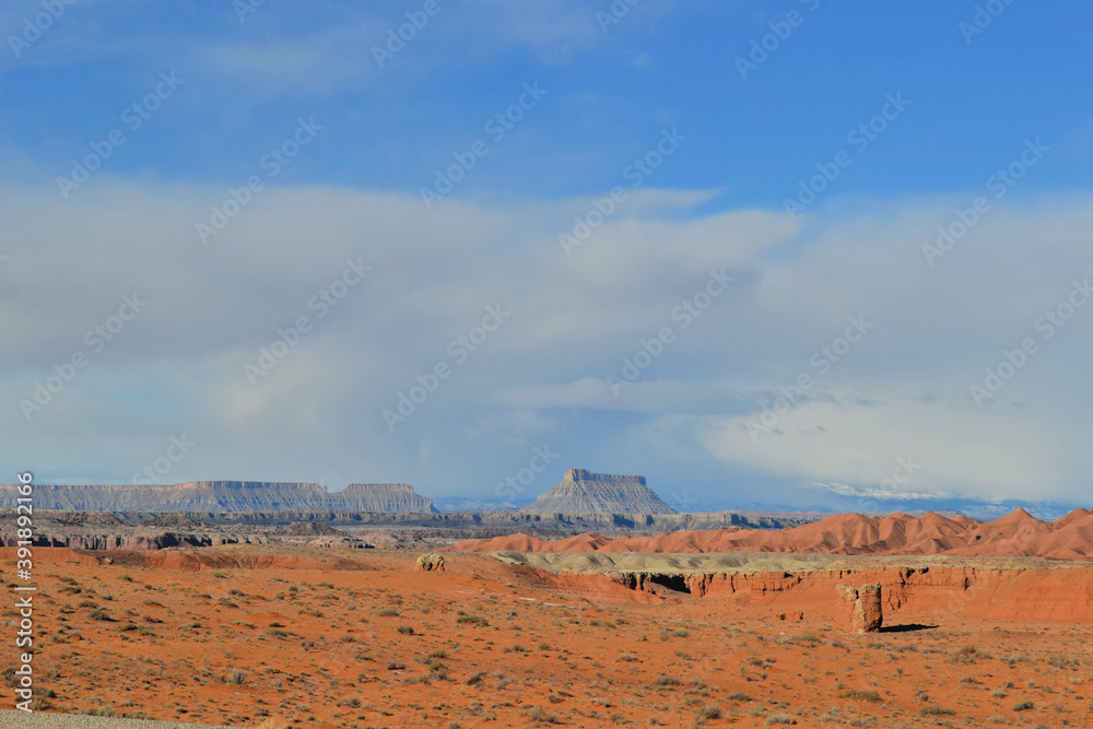 Road through a dessert with blue sky and red ground, Moab, Utah