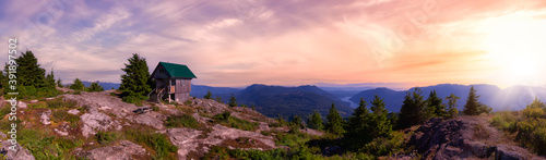 View of Tin Hat Cabin on top of a mountain. Dramatic Colorful Sunset Art Render. Located near Powell River, Sunshine Coast, British Columbia, Canada.