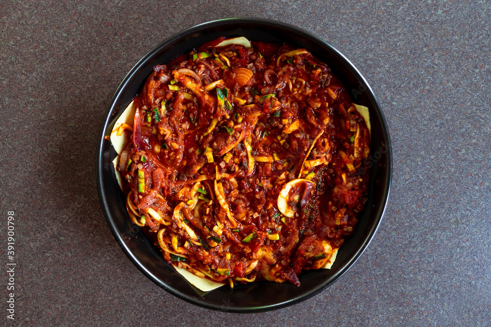 plant-based food, vegan lasagna with dairy free cheese spiralized zucchini and mushroom mince in garlic tomato sauce