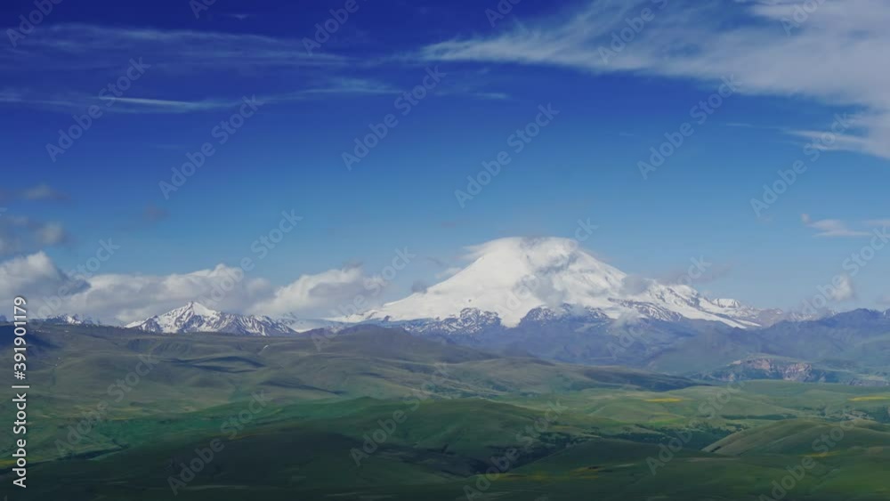 Beautiful view of Mount Elbrus and clouds, North Caucasus mountains, plateau Bermamyt, Russia, timelapse 4k Beautiful view of Mount Elbrus and clouds, North Caucasus mountains, plateau Bermamyt, Russia, timelapse 4k