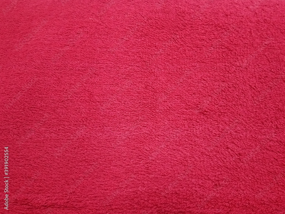 Fototapeta premium Red dye cotton fibrous bath body towel background