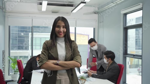 Asian businesspeople take off face mask and smile with confident 