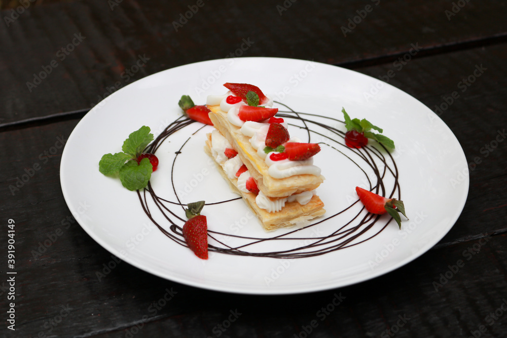 Strawberry Mille Feuille cake in white plate. Strawberry Mille Feuille cake in white plate.